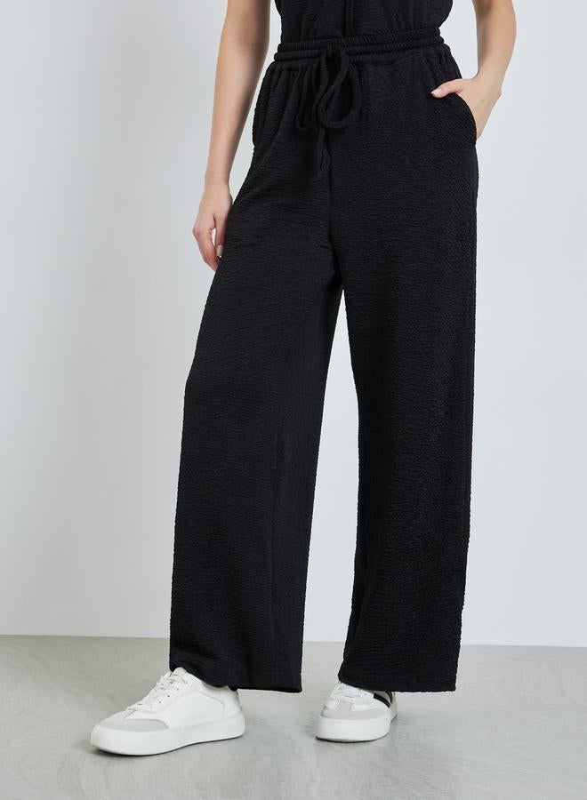 Styli Women Black Wide Leg Trousers with Drawstring - Image 1